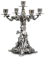 five-flames candelabra - sitting woman holding a bouquet of flowers